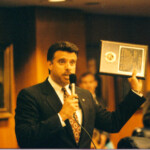 Rep. Carlos Valdes receives award from his colleagues on the House Floor. 1991 Session.